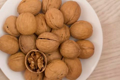 Plate full of nuts Stock Photos