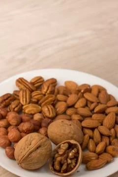Plate full of nuts Stock Photos
