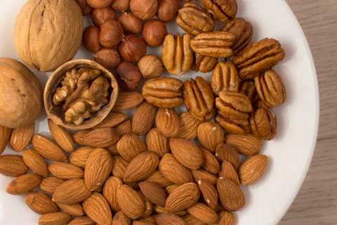 Plate full of nuts Stock Photos