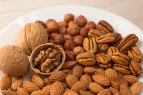 Plate full of nuts Stock Photos