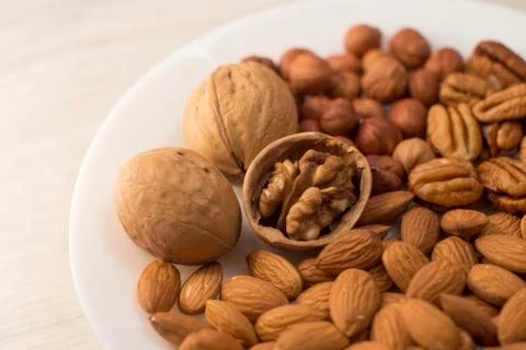 Plate full of nuts Foto stock