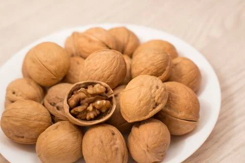 Plate full of wallnuts Stock Photos