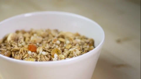 Plate with granola for breakfast in the morning in the kitchen Stock Footage