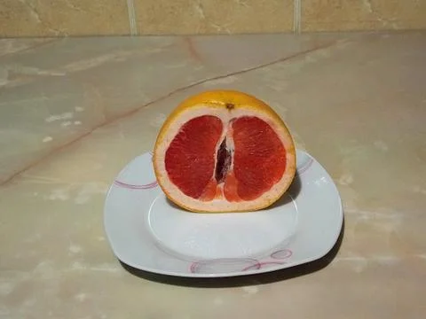Plate of grapefruit on the table Stock Photos