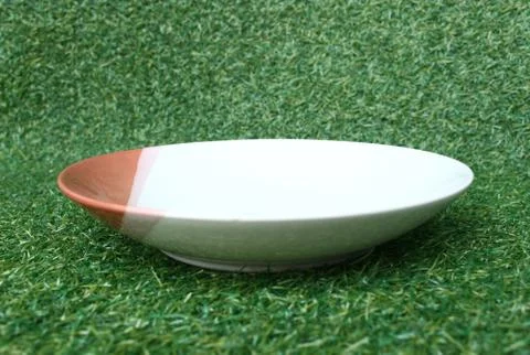 Plate on grass Stock Photos