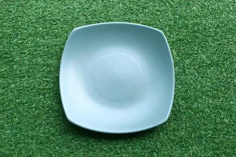 Plate on grass Stock Photos