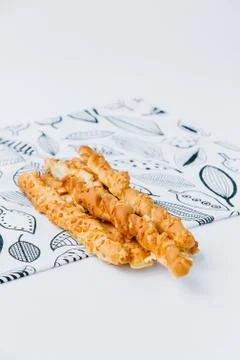 A plate of grissini on a table Foto stock