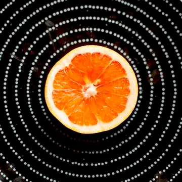 Plate with half grapefruit Stock Photos