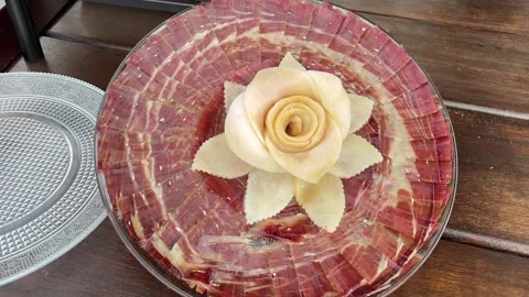 A plate of ham with a rose on top Stock Footage 278030257