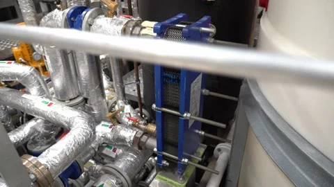 Plate heat exchanger inside ships engine room - From closeup to overview 動画素材 224360862