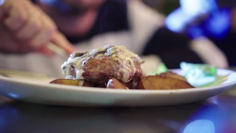 Plate with hot meat and fried potato. Dinner in a restaurant. Close up shot with Video stock 80266964