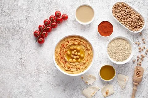 Plate of hummus flat lay with ingridients, healthy diet natural vegetarian snack Stock Photos