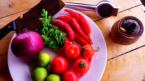 A plate of ingredients for red hot chilli sauce Stock Footage 129401438
