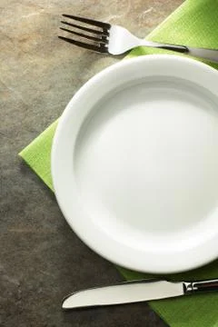 Plate, knife and fork Stock Photos