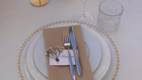Plate with knife and fork on the table set Stock Footage 309928734