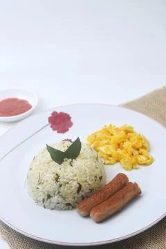 A plate of lime leaf fried rice which is a blend of rice and lime leaves Stock Photos
