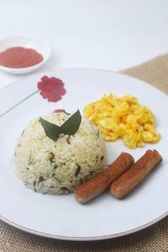 A plate of lime leaf fried rice which is a blend of rice and lime leaves Stock Photos