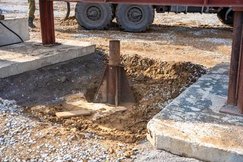 Plate load test in progress with heavy weight applying static pressure on soil Stock Photos
