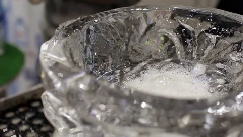 A Plate Made of Ice is Filled With Water and Dry Ice Video stock 74764915