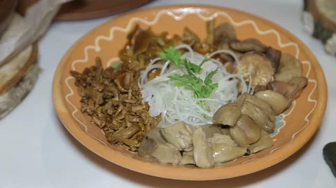 Plate of marinated mushrooms on the table Stock Footage 58968940