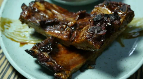 Plate with meat and grilled ribs Stock Footage 59657967