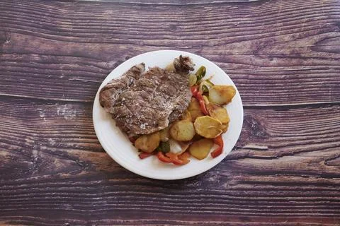 A plate of meat and potatoes Stock Photos