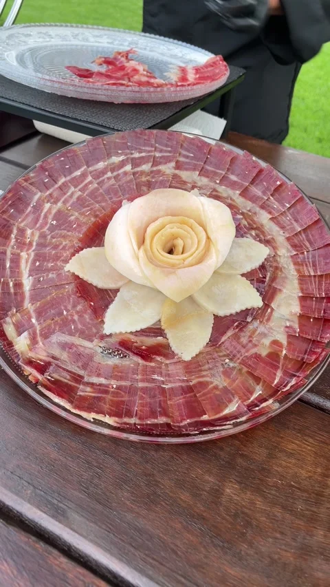 A plate of meat with a rose on it Stock Footage 278034735