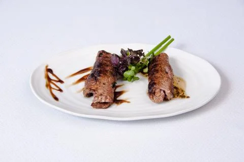 A plate of meat on white a background Stock Photos