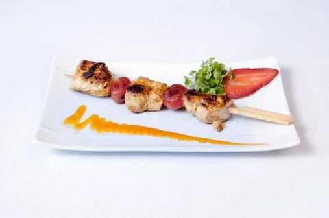 A plate of meat on a white background Stock Photos