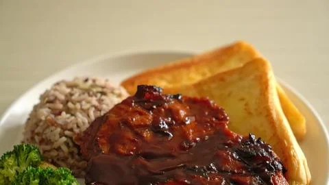 Plate of meatloaf with mashed potatoes and gravy on green background Stock Photos