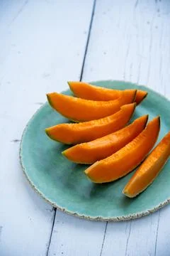 Plate with melon slices Stock Photos