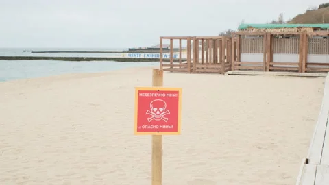 Plate minefield on the beach Stock Footage 176486179