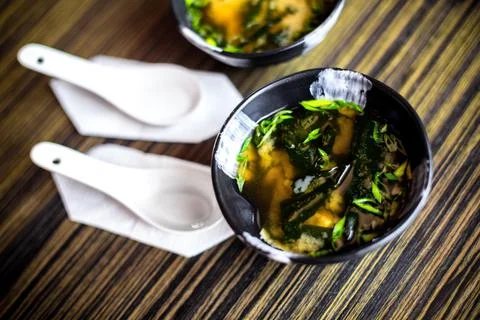 Plate with miso soup at the table. Stock Photos