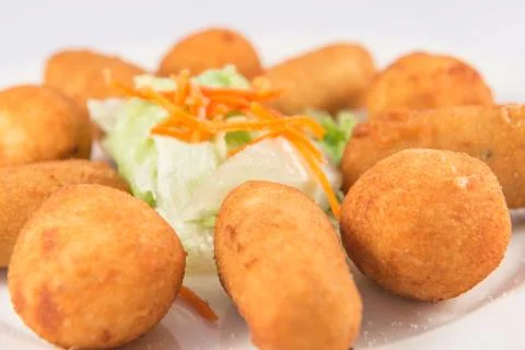 Plate of mixed ham and cod croquettes with lettuce. Stock Photos