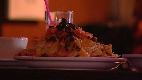Plate of Nachos in Bar Stock Footage 93795410