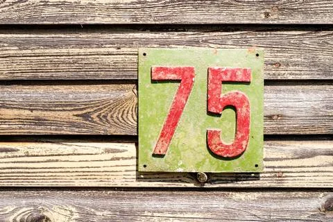 Plate with a number on the wall Stock Photos