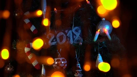 Plate numbered 2018 on the Christmas tree, New Year's background. Stock Footage 82498868