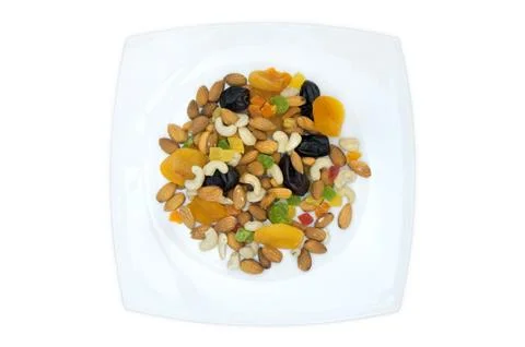 Plate with nuts on white background Stock Photos