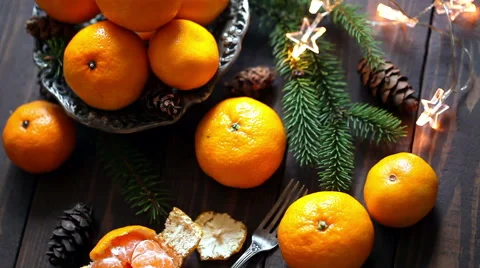 Plate with orange mandarins, Christmas or New Year concept, toned Stock Footage