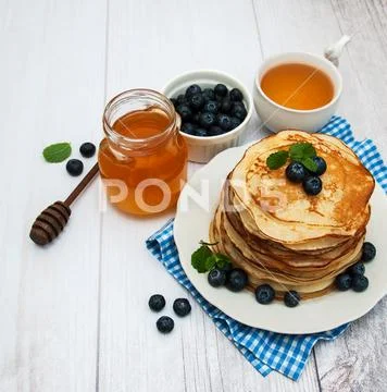 Plate with pancakes and blueberries Stock Photos