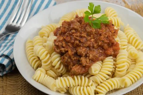 Plate of pasta bolognese on a table Stock Photos