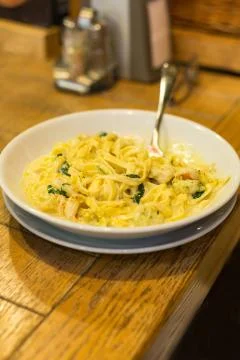 A plate of pasta on the table. Stock Photos