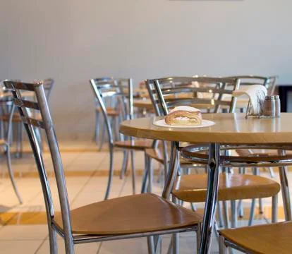 Plate with a pastry on a table in a cafe Stock Photos