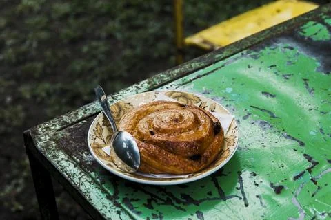A plate with a pastry on top of a table Stock Photos