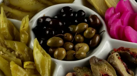 Plate of pickles (eggplant, cucumbers, turnips, olives), loop Stock Footage 61707901