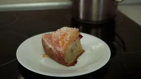 Plate with a piece of cake and hand to take the plate away Stock Footage 74871590