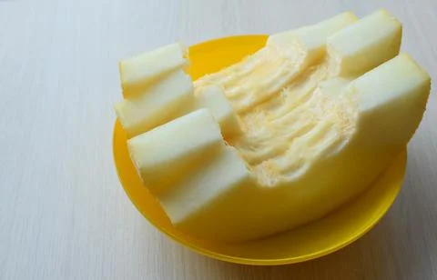 Plate with pieces of melon Stock Photos