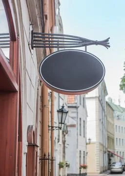 Plate with place for text on the bracket on the facade Stock Photos