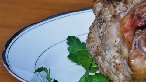 On the plate with pork knuckle put stewed cabbage Stock Footage 85163584