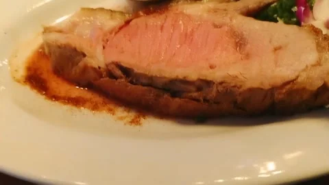 A plate of prime rib Stock Footage 311389765